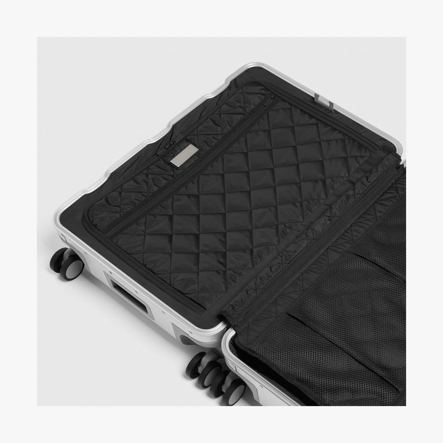 Caviar Black | Left interior view of Aluminum Check-In Medium in Caviar Black