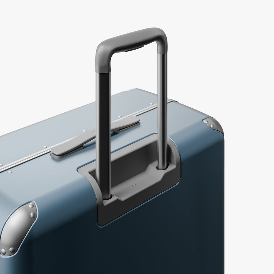 Elemental Blue | Extended luggage handle view of Hybrid Check-In Large in Elemental Blue