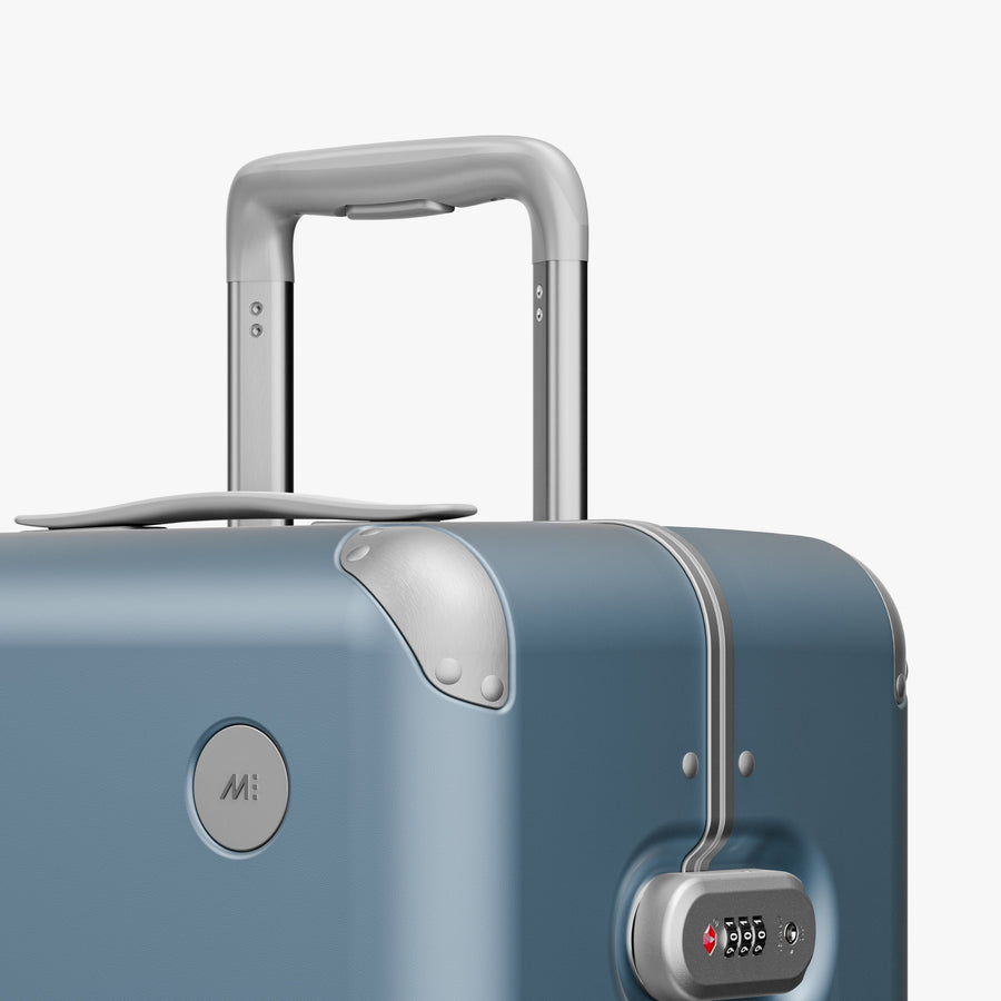 Elemental Blue | Luggage handle view of Hybrid Check-In Medium in Elemental Blue