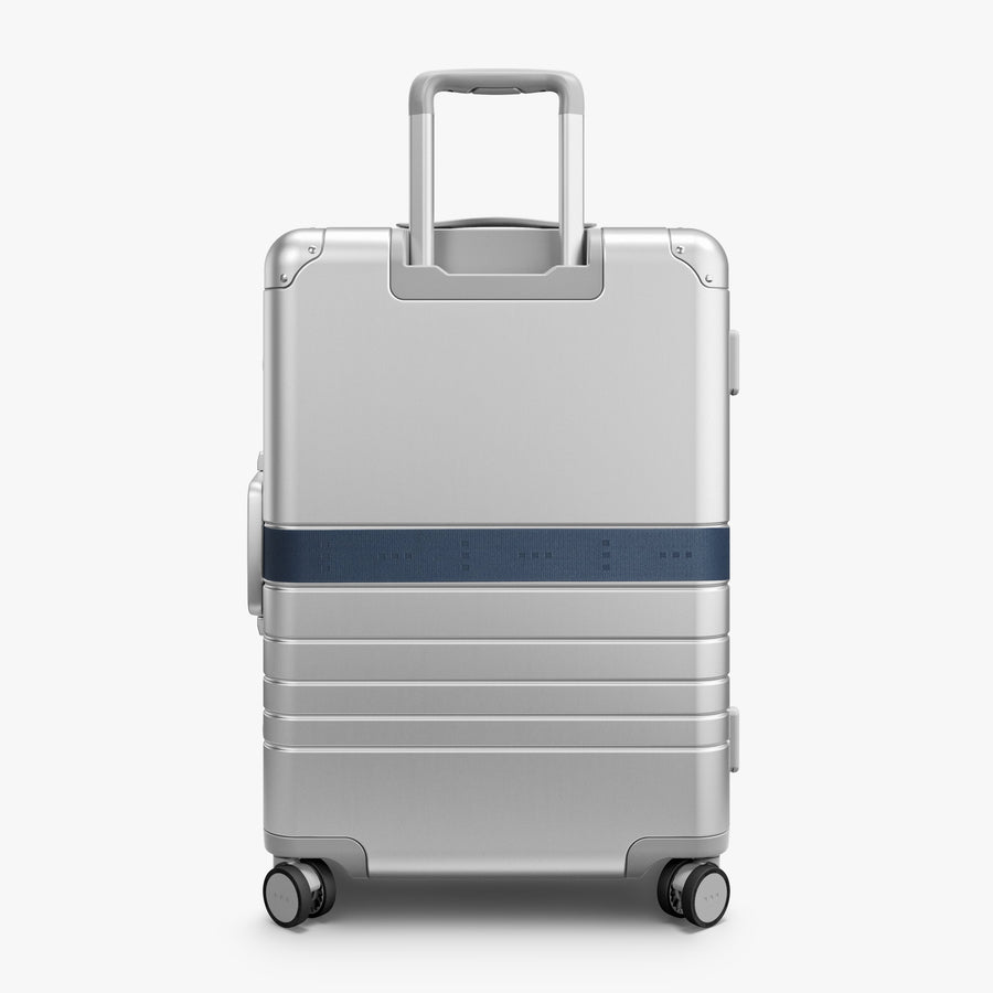 Ocean Blue | Back view of Aluminum suitcase with the Ocean Blue Luggage Strap secured around it