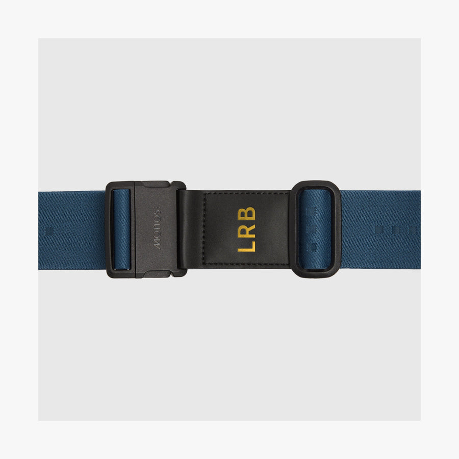 Ocean Blue | Front view of an Ocean Blue Luggage Strap featuring gold monogrammed letters