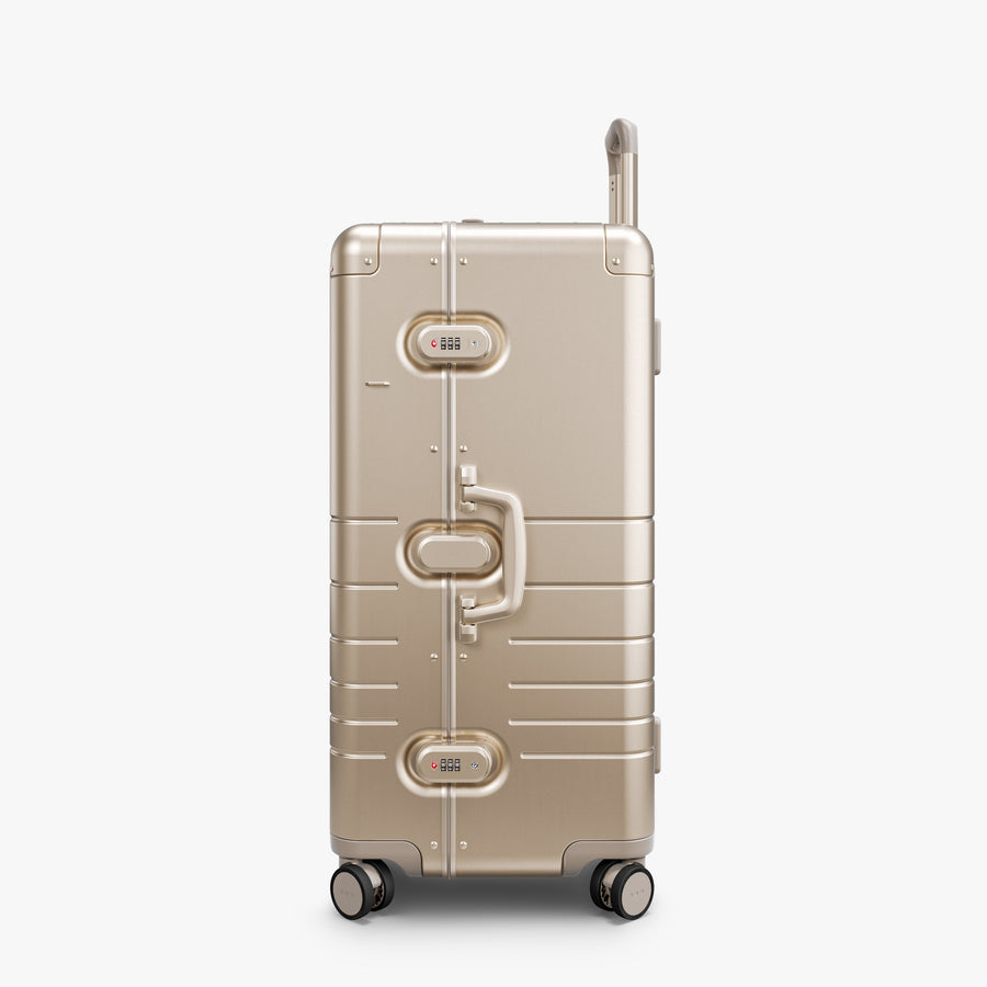 Champagne Gold | Side view of Aluminum Trunk in Champagne Gold