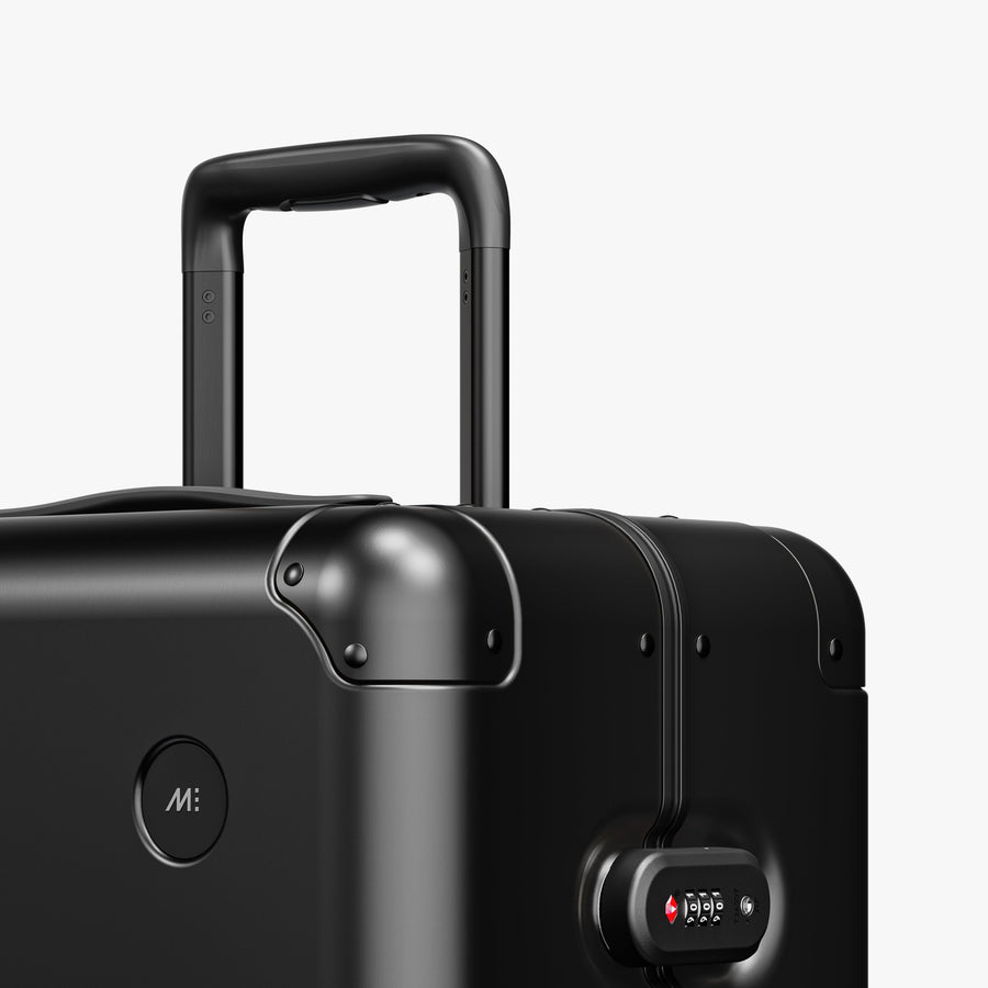 Caviar Black | Luggage handle view of Aluminum Check-In Large in Caviar Black