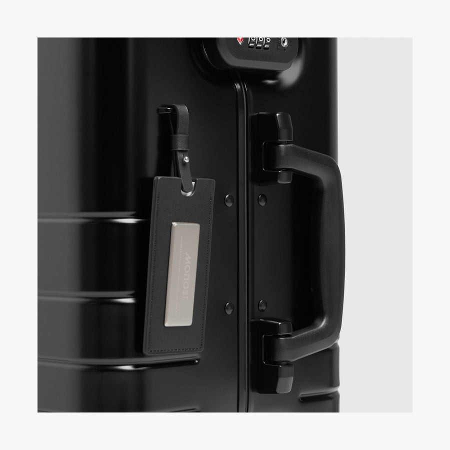 Caviar Black | Luggage tag view of Aluminum Carry-On Plus in Caviar Black