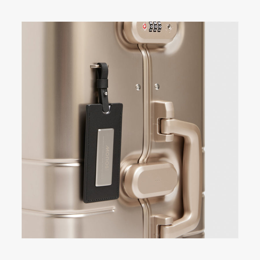 Champagne Gold | Luggage tag view of Aluminum Check-In Large in Champagne Gold