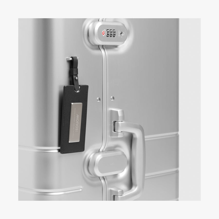 Aspen Silver | Luggage tag view of Aluminum Trunk in Aspen Silver