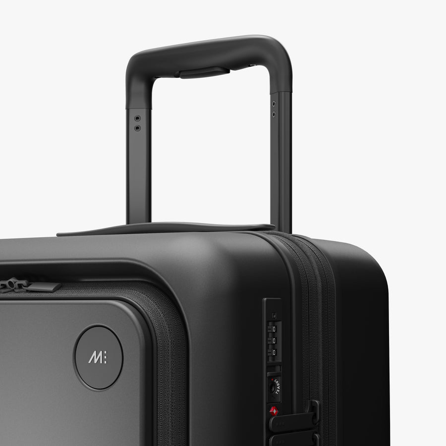 Midnight Black | Luggage handle view of Expandable Carry-On Pro in Midnight Black