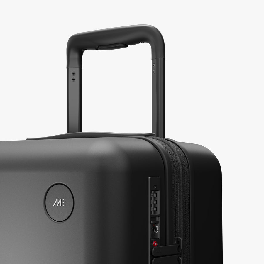 Midnight Black | Luggage handle view of Expandable Carry-On in Midnight Black