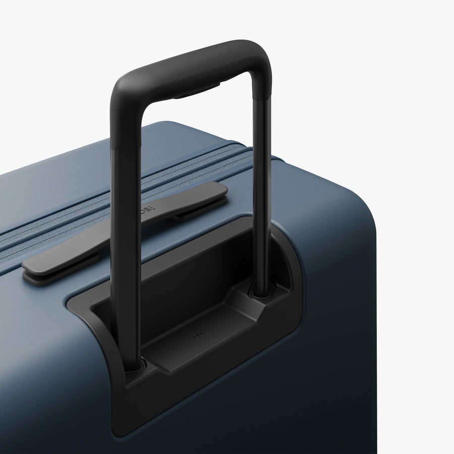 Ocean Blue | Extended luggage handle view of Expandable Check-In Medium in Ocean Blue