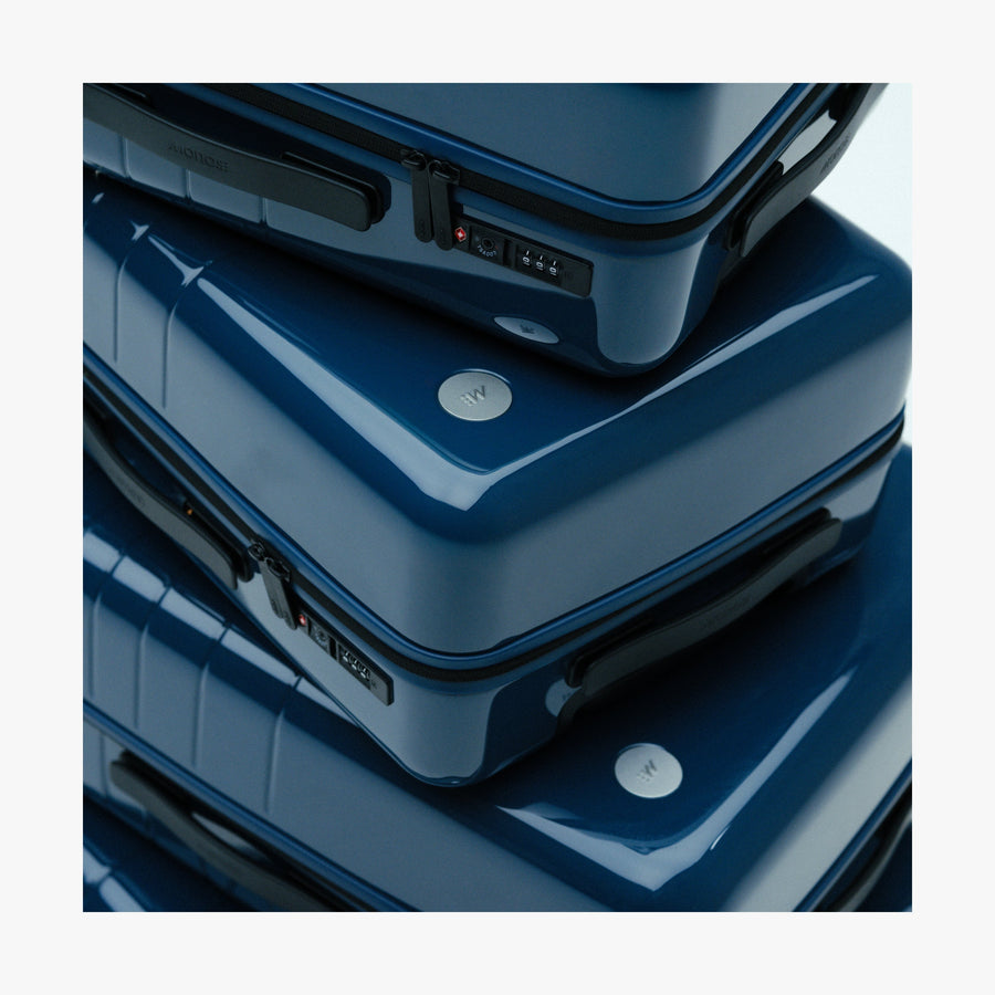 Set of Six / Arles Blue | Stacked Arles Blue suitcases in different sizes