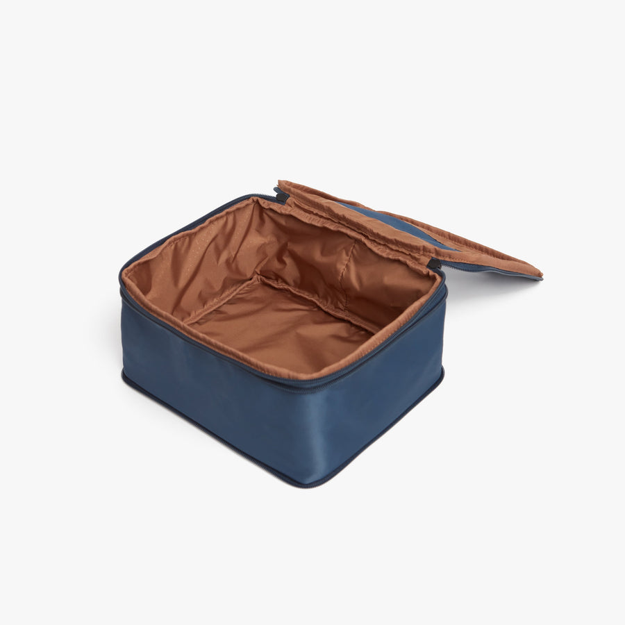 Set of Six / Arles Blue | Photo of an open compressible packing cube with its empty interior visible