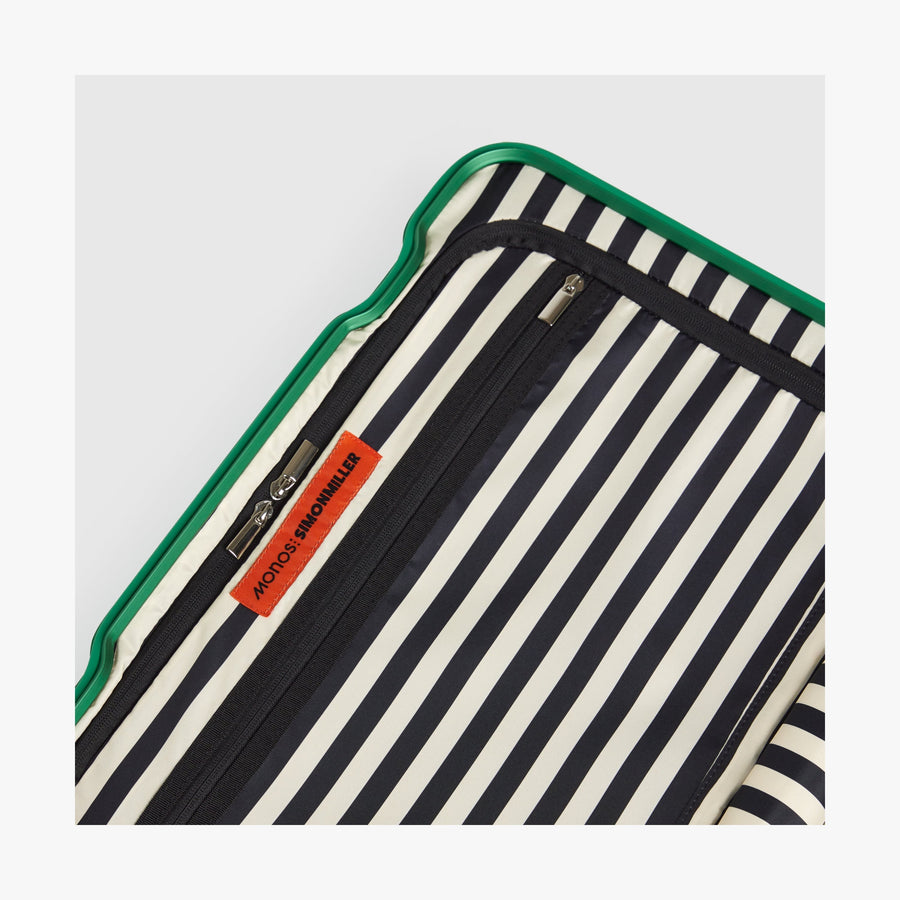 Jungle Green | Close-up view of the Hybrid suitcase interior in Jungle Green, featuring the Poplin Stripe Jungle Green zipped compartment