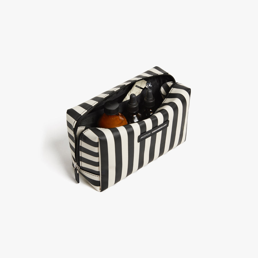 Large / Poplin Stripe Black | Front angled view of the opened large Metro Toiletry Case in Poplin Stripe Black, showing travel essentials stored inside