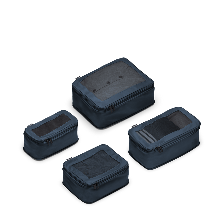 Set of Four / Arles Blue Scaled | This is a photo of a set of four compressible packing cubes in Arles Blue