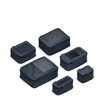 This is a photo of a set of six compressible packing cubes in Arles Blue