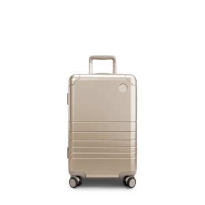 Champagne Gold Scaled | Front view of Aluminum Carry-On Plus in Champagne Gold