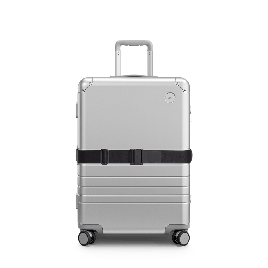 Midnight Black Scaled | Front view of Aluminum suitcase with the Midnight Black Luggage Strap secured around it