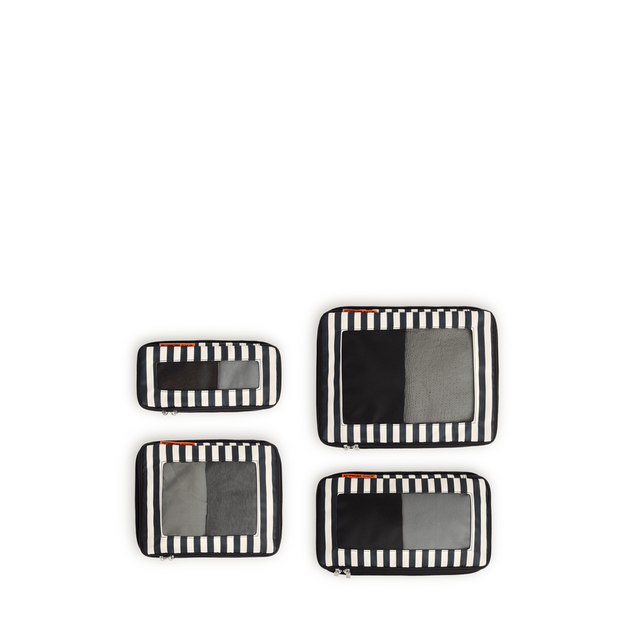 Set of Four / Poplin Stripe Black Scaled | Set of four Poplin Stripe Black compressible packing cubes arranged flat to show all sizes