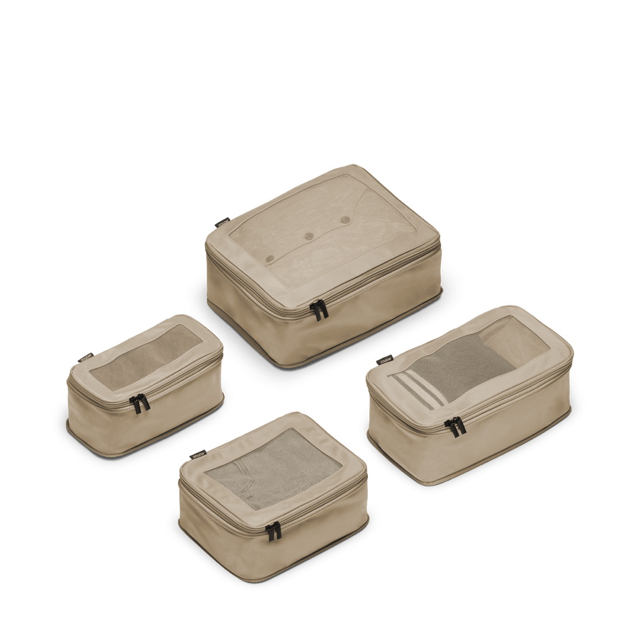 Set of Four / Tan Scaled | This is a photo of a set of four compressible packing cubes in tan