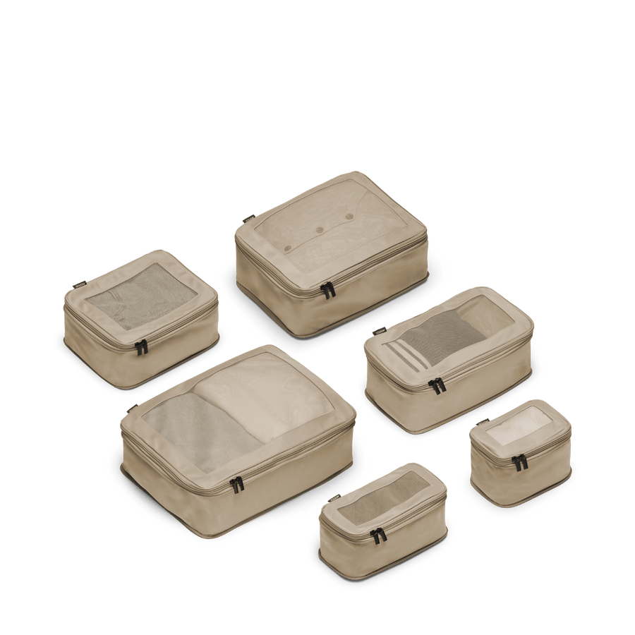 Set of Six / Tan Scaled | This is a photo of a set of six compressible packing cubes in tan