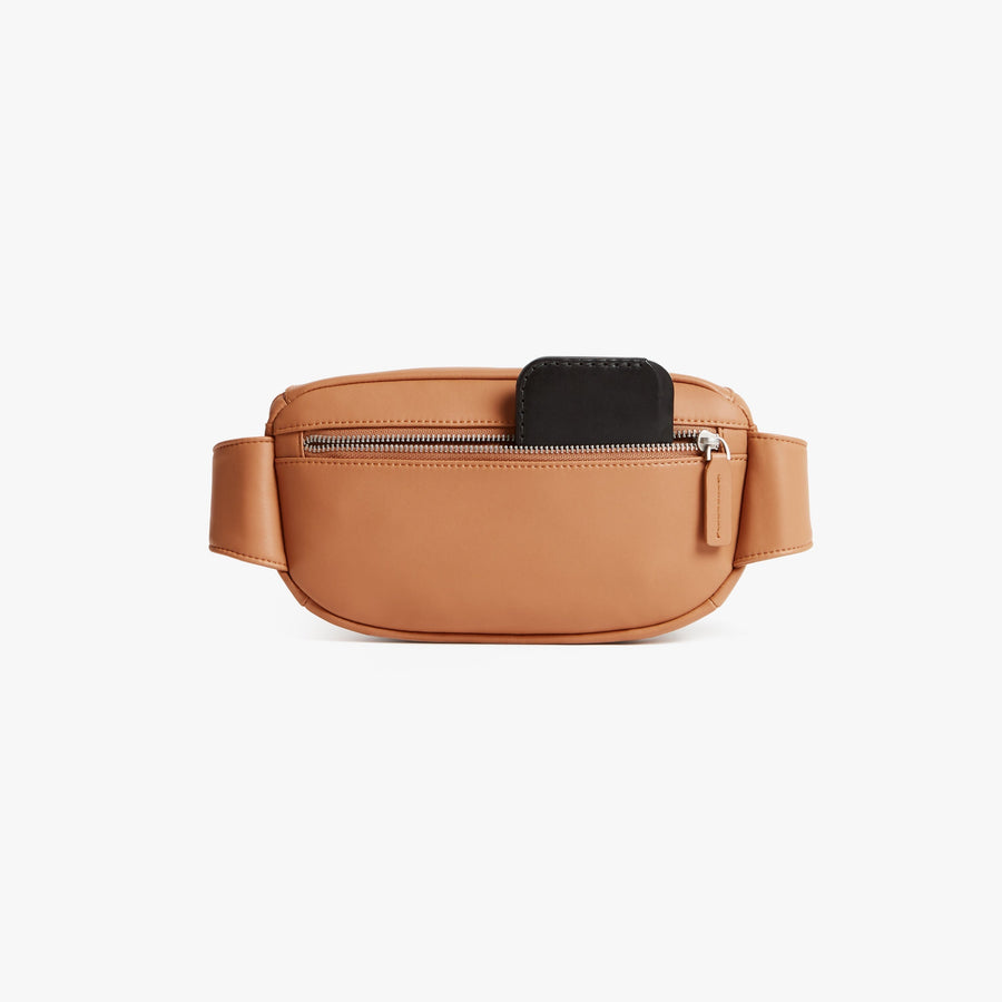 Saddle Tan (Vegan Leather) | Back pouch view of Metro Sling in Saddle Tan
